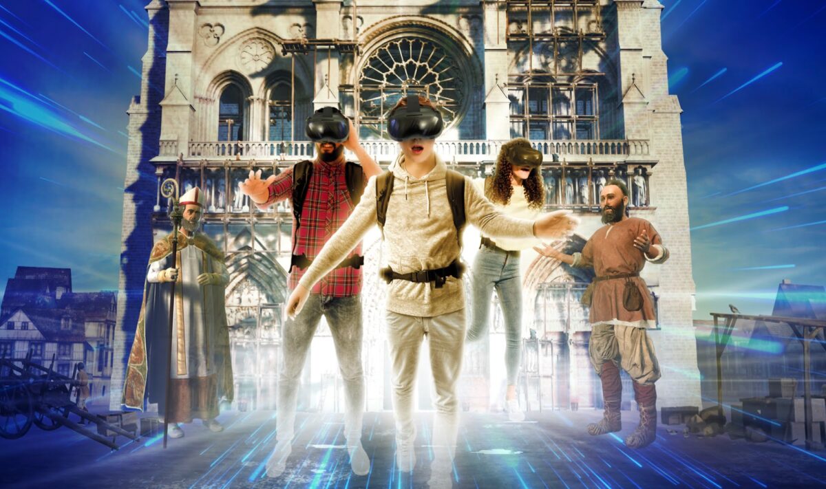 Visitors wearing VR glasses are sucked into VR, with Notre Dame in the background.