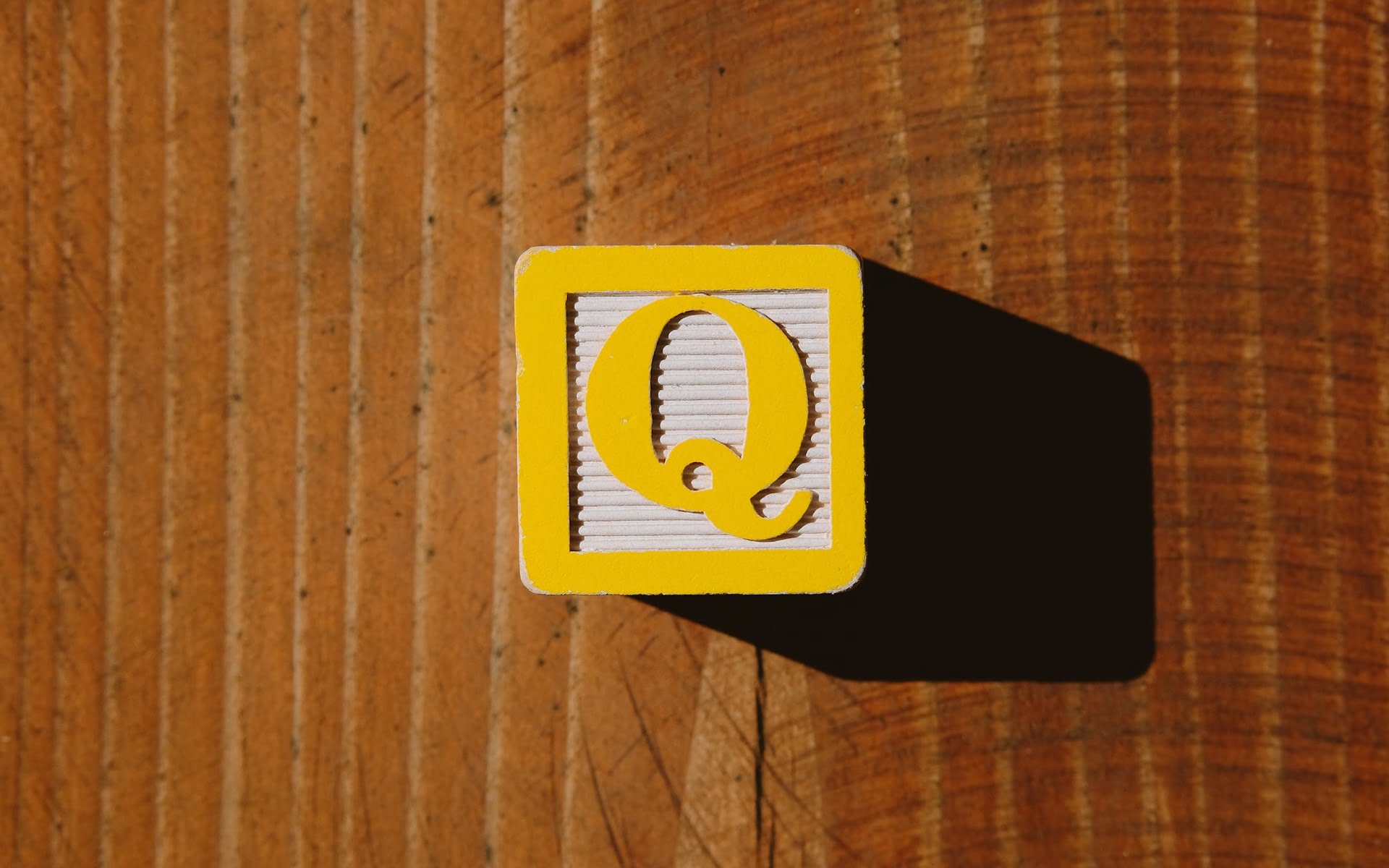 Yellow cube with the letter Q