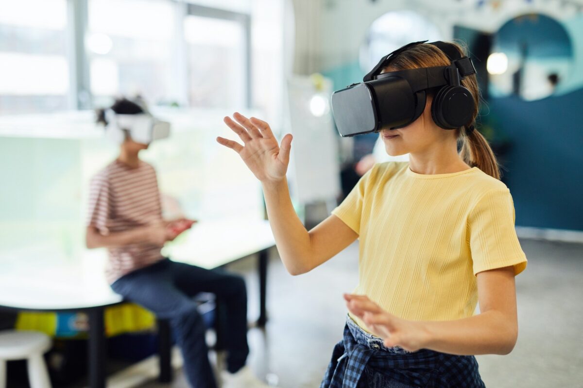 A girl and a boy with VR glasses