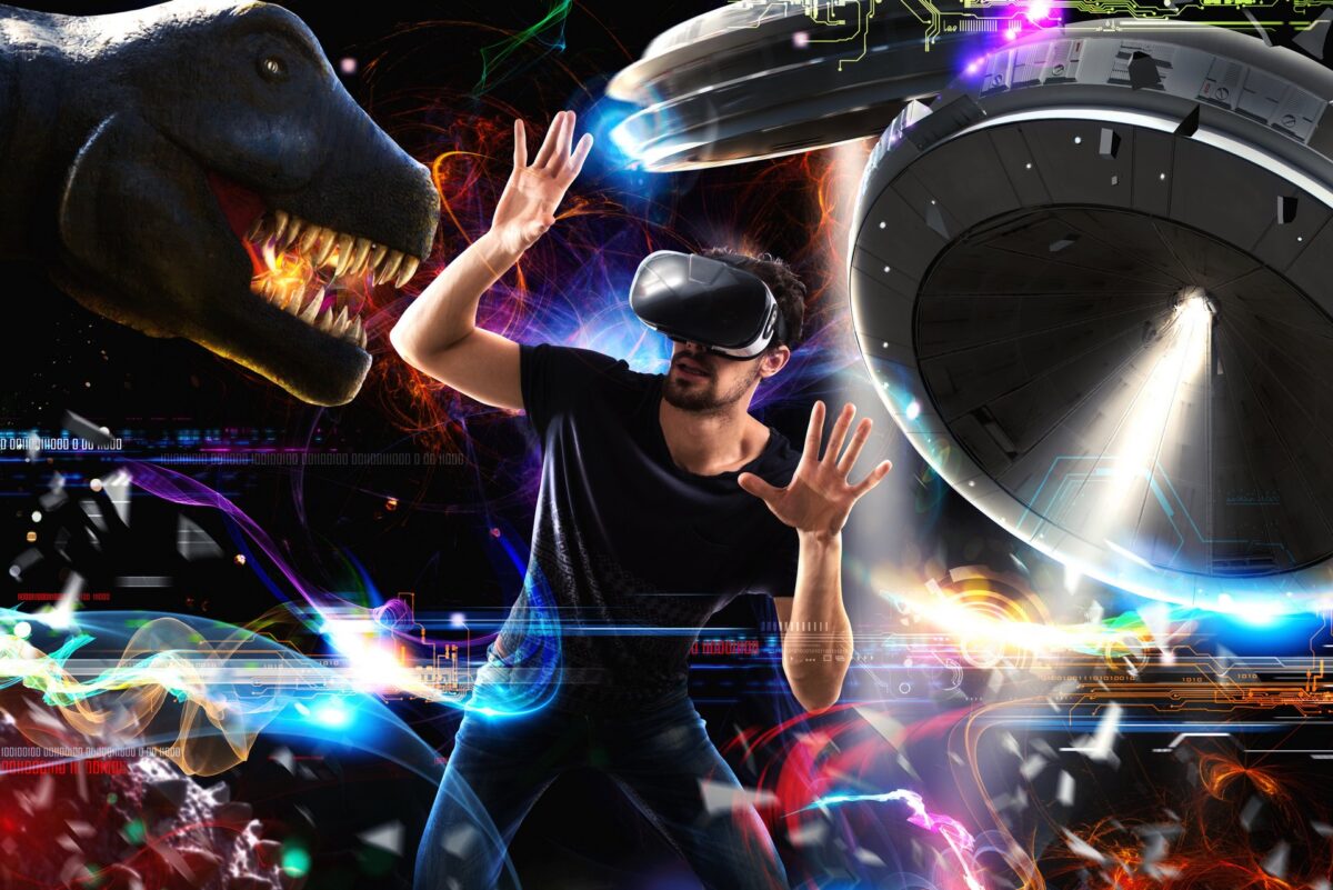 Man with VR headset, behind it a dinosaur head, spaceships and many bright colors