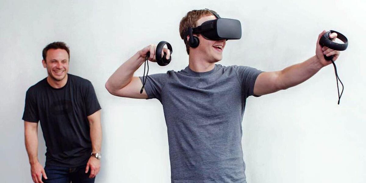 Zuckerberg plays Oculus Rift with gusto, Brendan Iribe laughs in the background.