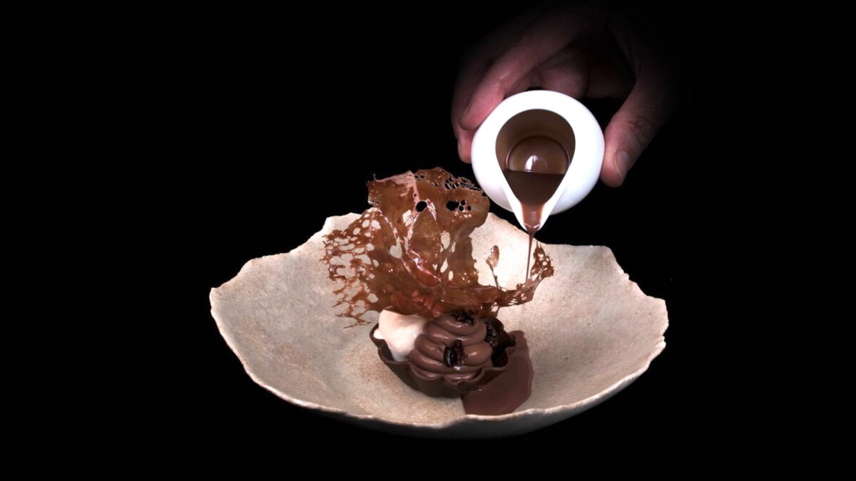 An appetizing chocolate dessert against a black background.
