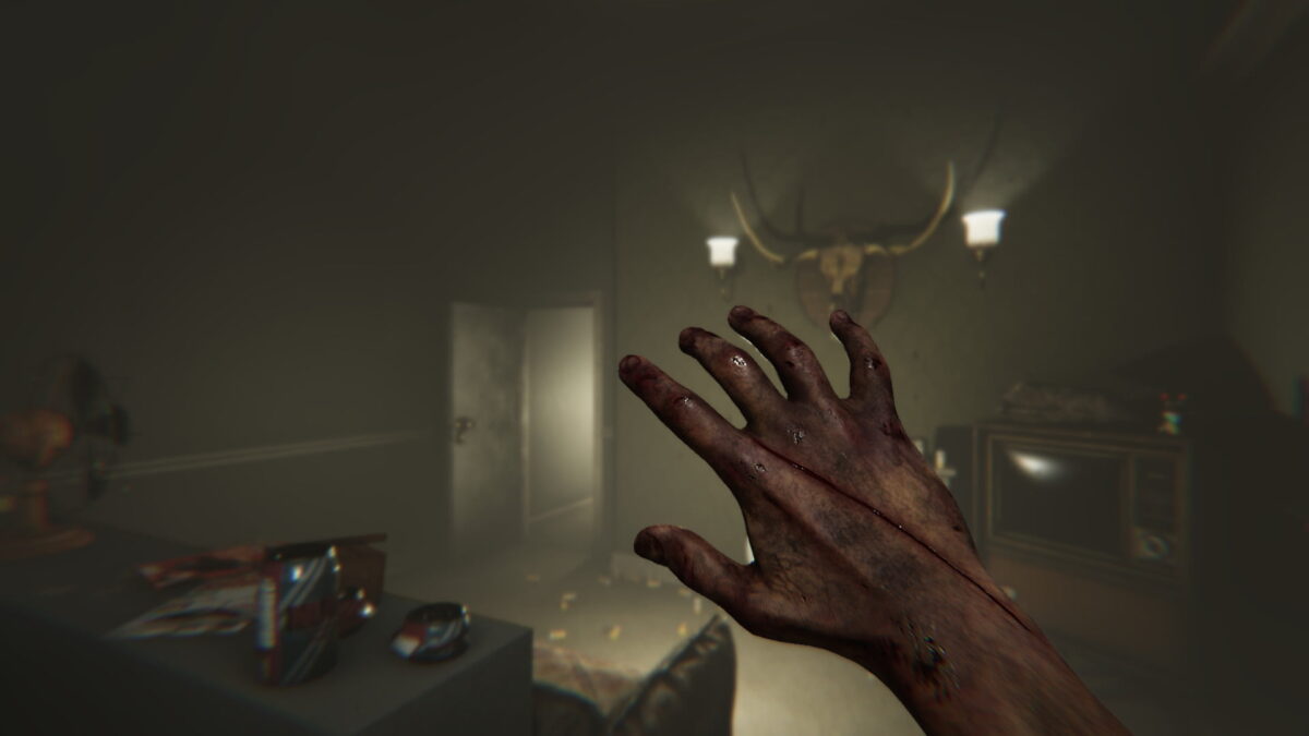An outstretched hand from the ego view in a creepy house.