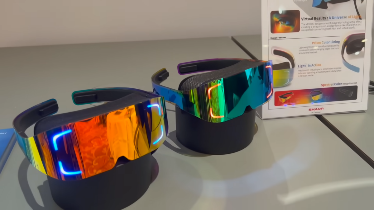 A set of very sleek and thin VR headsets with a colorful front. They have temples like regular glasses instead of a headband.