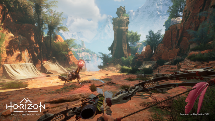 Plateau with a tent and mountains in the background, on it an enemy robot, in the foreground the bow of the VR player in Horizon Call of the Mountain.