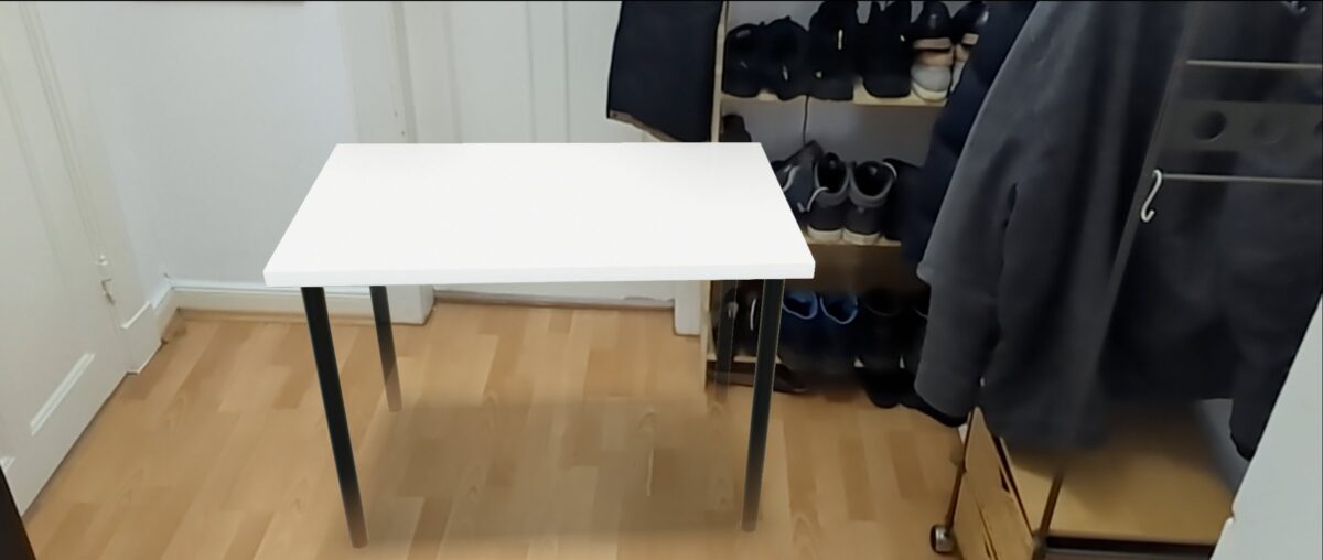 A room with a white Ikea table.