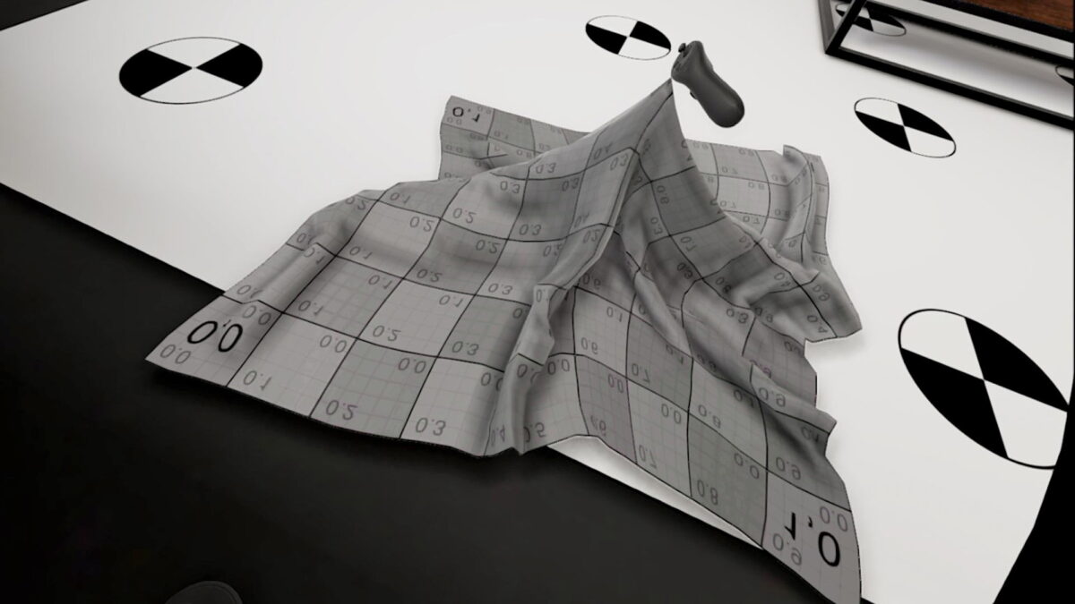 A touch controller grabs a piece of virtual fabric in a VR environment, which deforms realistically.
