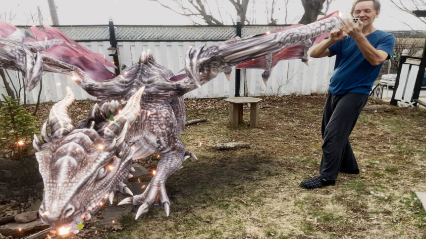 The HoloKit X app can put an AR dragon in your garden for other players to battle.