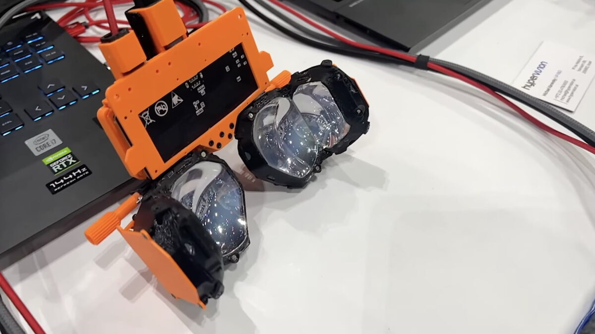 Image of the Hypervision VR240 Gen 2 shows a rudimentary VR testbench with two pancake lenses fused together.