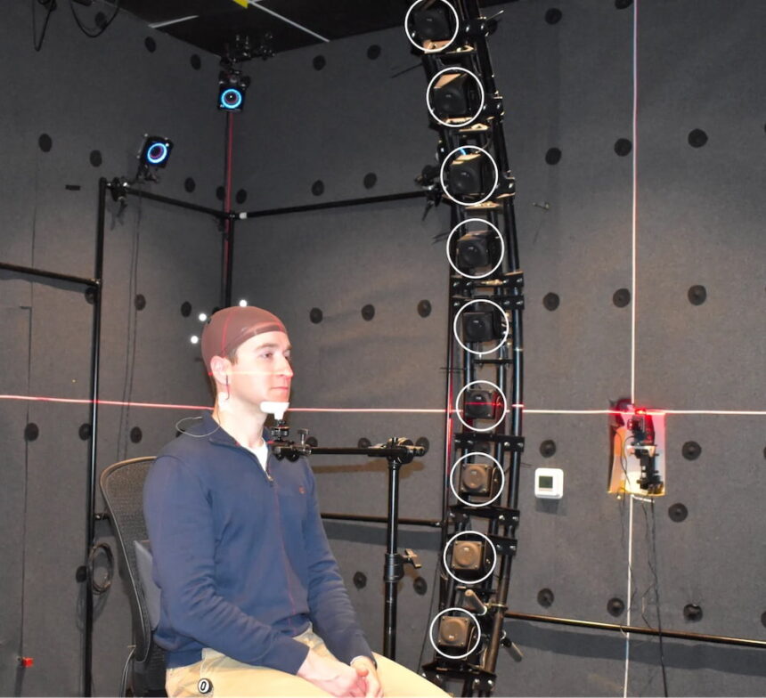In the Reality Labs research lab, an employee's head and ears are measured in 3D.