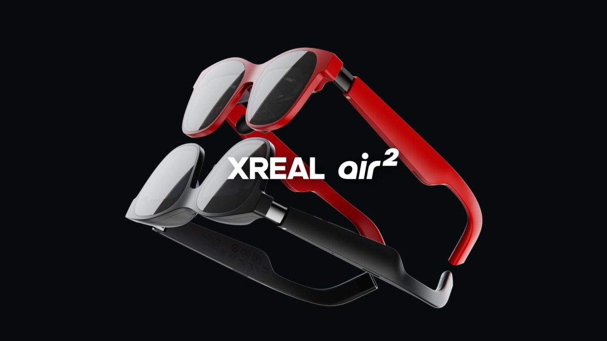 A red and a black variant of the AR headset Xreal Air 2 lie on top of each other.