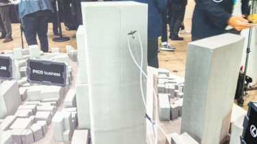 Smartphone view of block model of Shibuya with AR planes in front of skyscraper