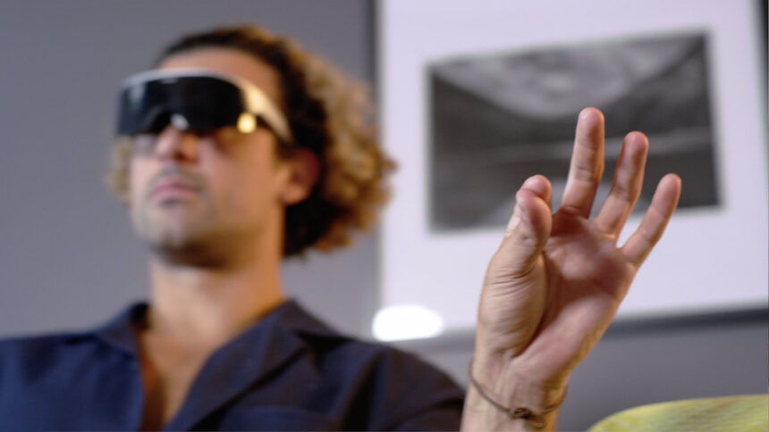 A person controlling an Immersed Visor with a pinch gesture.