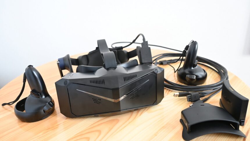 VR headset Pimax Crystal on table with accessories
