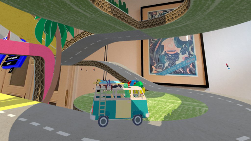 A small virtual cardboard VW bus drives on a virtual road made of cardboard.
