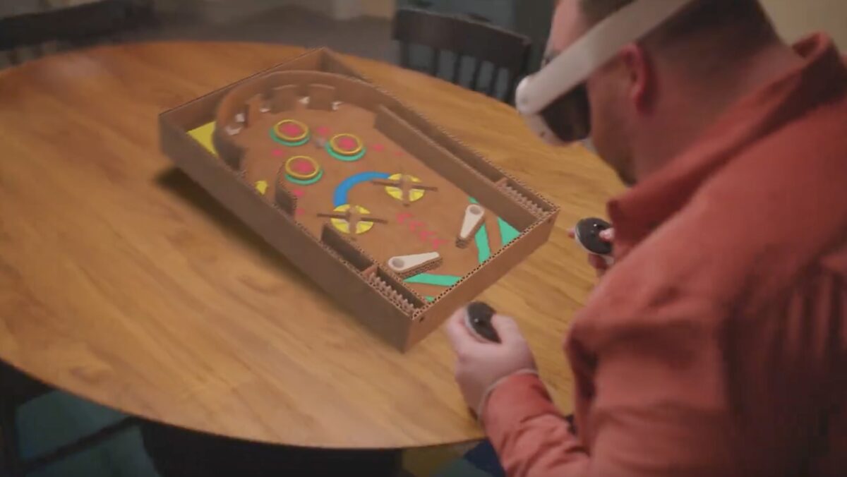 Man playing mixed reality pinball at the table.