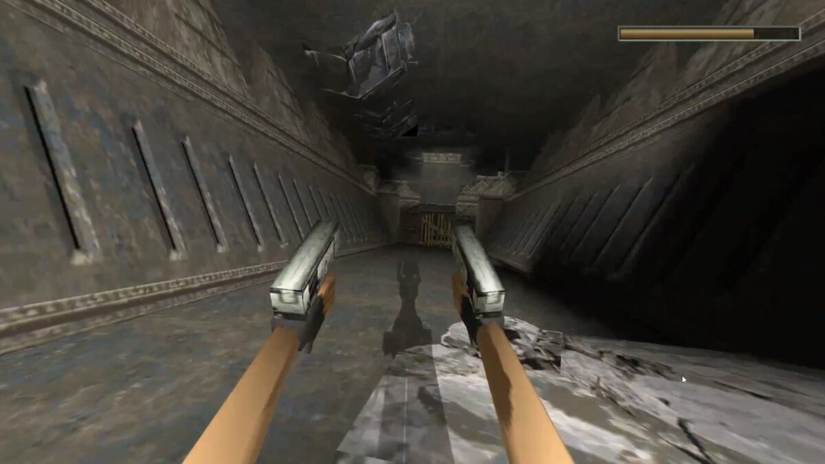 Tomb Raider from a first-person perspective: We see a corridor and Lara Croft's hands, guns and shadows.