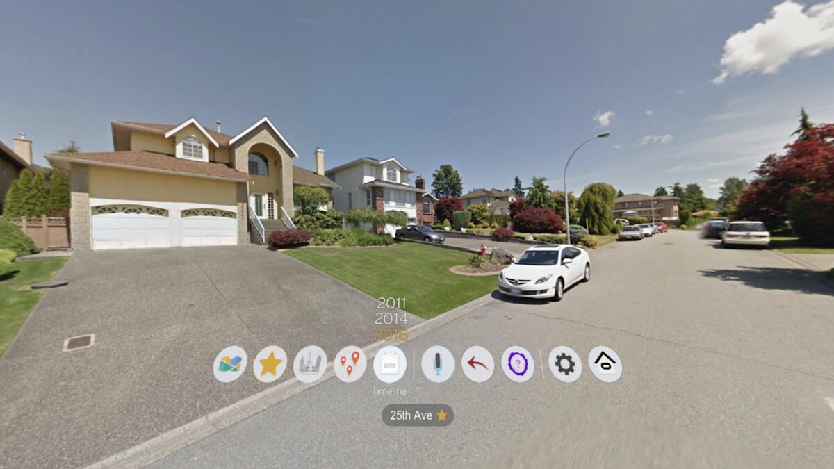 Streetview view of a typical US suburb with street, cars and houses, with walking user interface.