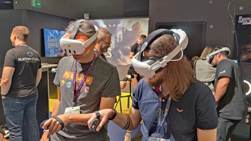 Two men stand next to each other with VR headsets on their heads and controllers in their hands.