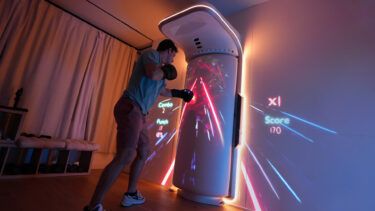 This AI-controlled punching bag projects a life-size fitness coach into your living room