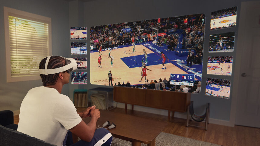 A man wearing VR headsets looks at a virtual screen floating in his living room.