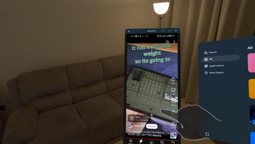 The display of a smartphone is mirrored in the mixed reality environment of a Meta Quest 3.