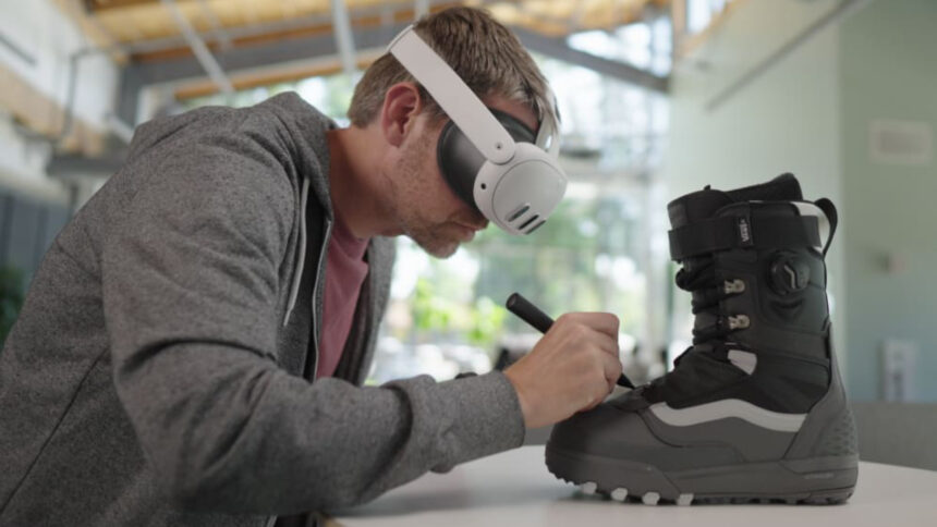 A man with VR headsets writes on a ski boot.